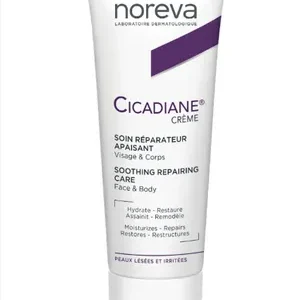 Tube of Noreva Cicadiane SPF 50+ Cream with a white and blue label, highlighting its sun protection and repair benefits.